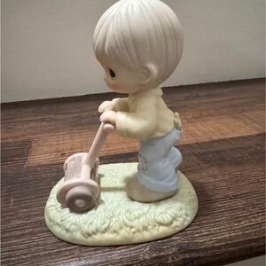 1989 Members Only figurine “Mow power to ya!”
